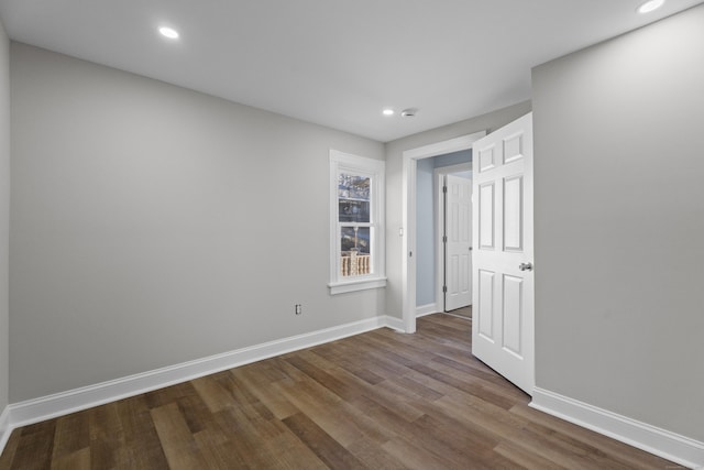 unfurnished room featuring wood-type flooring