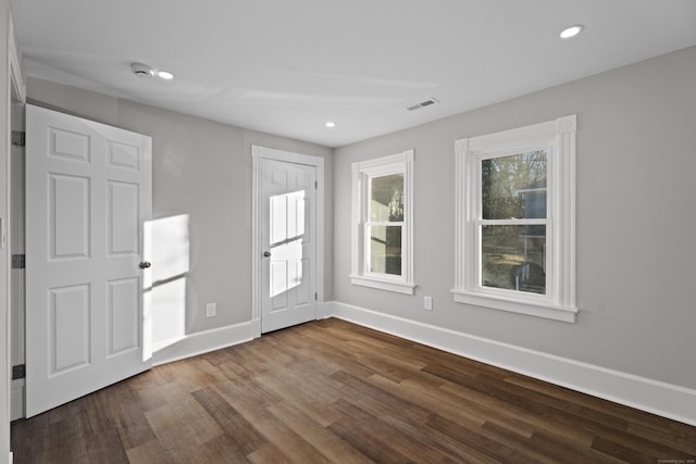 spare room with hardwood / wood-style flooring