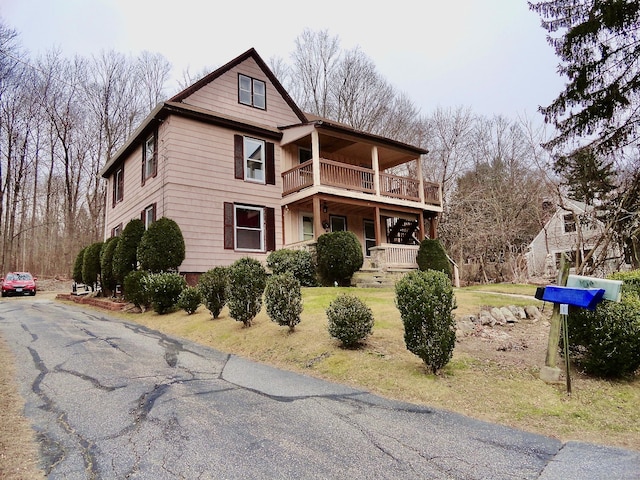 39 Baker St, Winchester, CT 06098 - view of property featuring a balcony, a porch, and a front yard