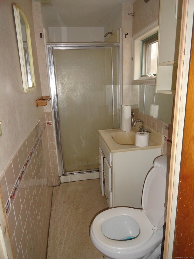 39 Baker St, Winchester, CT 06098 - bathroom with vanity, toilet, tile walls, and walk in shower