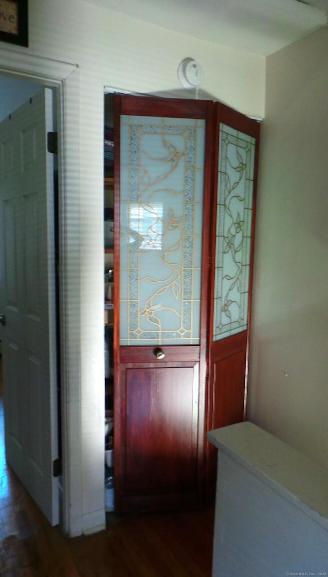 doorway with dark hardwood / wood-style floors