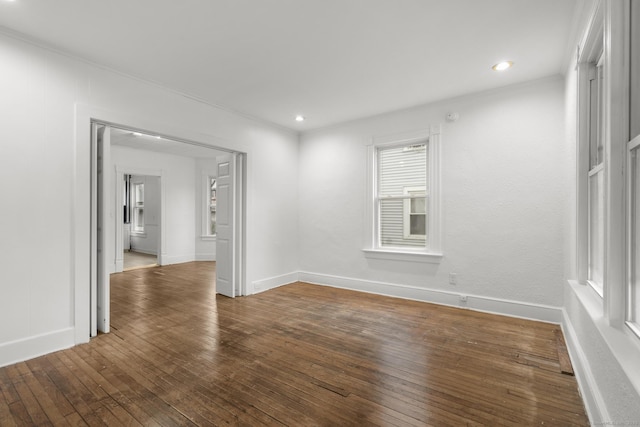 unfurnished room featuring dark hardwood / wood-style floors