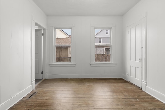 empty room featuring dark hardwood / wood-style flooring