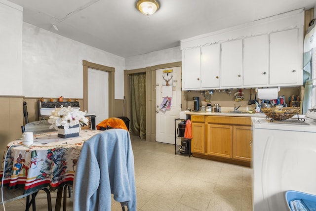 kitchen featuring washer / clothes dryer and sink