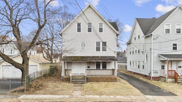 view of front of house featuring covered porch and a garage