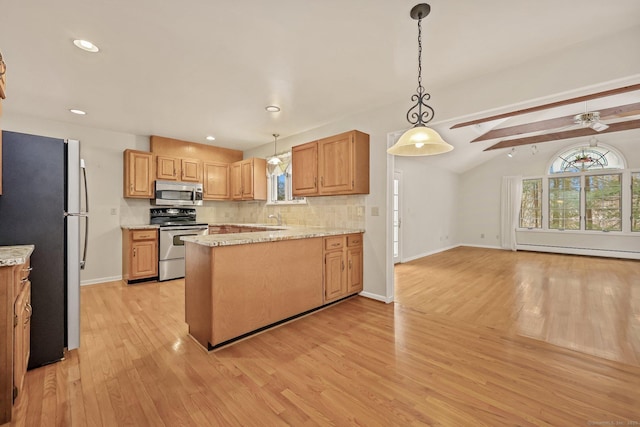 kitchen featuring decorative light fixtures, backsplash, stainless steel appliances, vaulted ceiling with skylight, and a baseboard heating unit