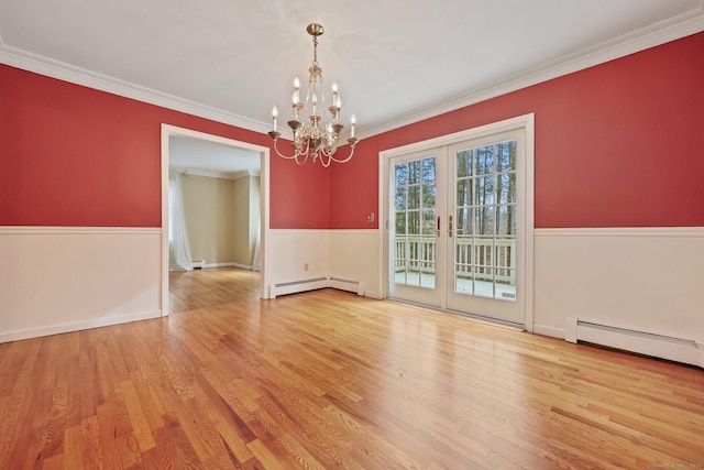 unfurnished room featuring french doors, a baseboard radiator, ornamental molding, and light wood-type flooring