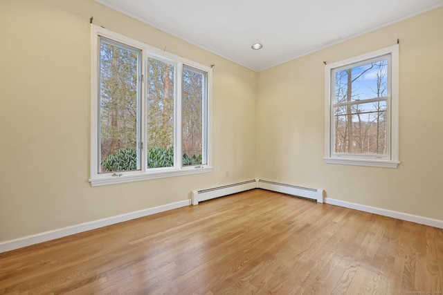 unfurnished room with plenty of natural light and light hardwood / wood-style floors