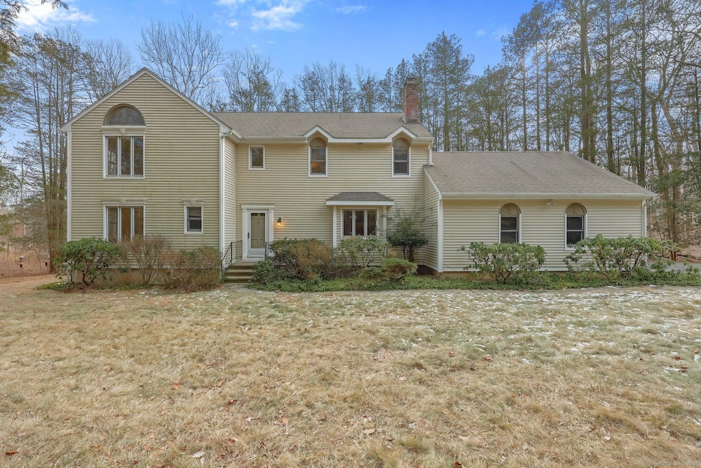 view of front of home with a front yard