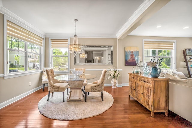 dining room featuring crown molding, dark wood-type flooring, and a chandelier