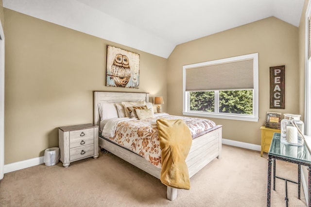 carpeted bedroom featuring vaulted ceiling