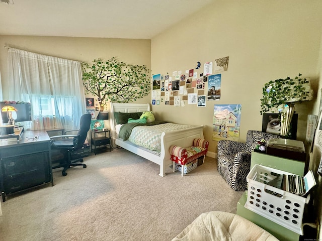 bedroom featuring lofted ceiling and carpet floors