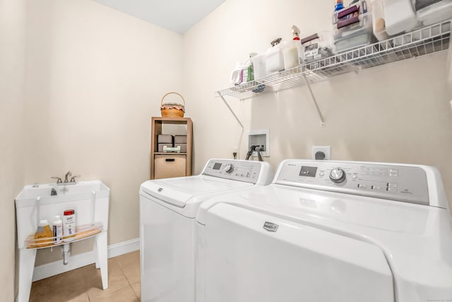 washroom featuring light tile patterned floors and separate washer and dryer