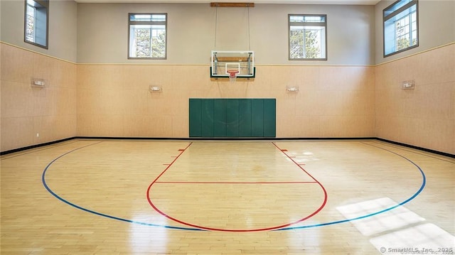 view of basketball court featuring a wealth of natural light