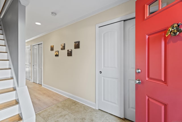 tiled foyer with crown molding