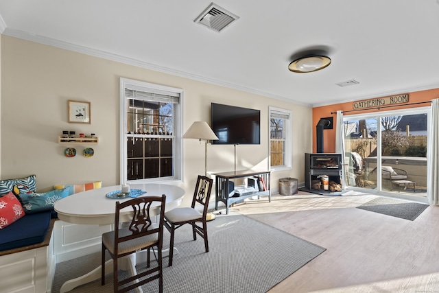 living room featuring hardwood / wood-style floors and crown molding