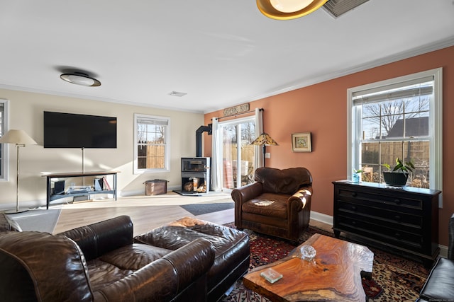 living room with crown molding and hardwood / wood-style floors