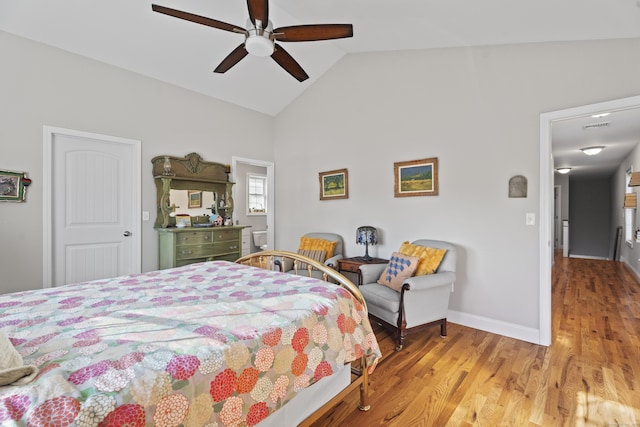 bedroom featuring ceiling fan, light hardwood / wood-style floors, and lofted ceiling