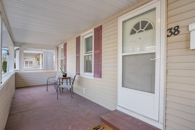 property entrance with covered porch