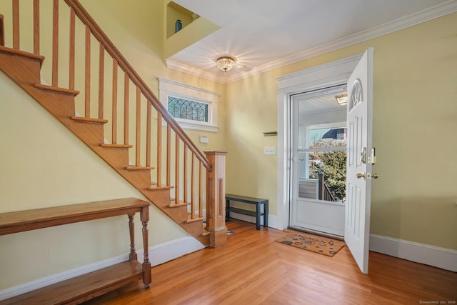 foyer featuring ornamental molding