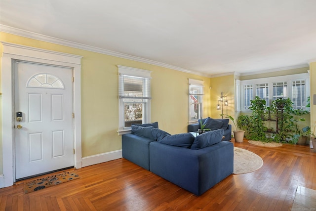 living room featuring a healthy amount of sunlight, dark hardwood / wood-style flooring, and crown molding