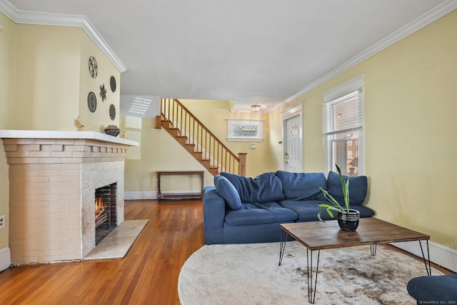 living room featuring a fireplace, dark hardwood / wood-style floors, and ornamental molding