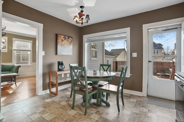 dining space featuring a notable chandelier