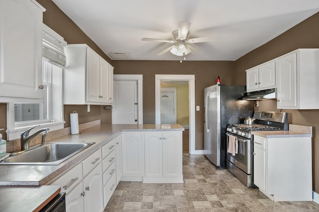 kitchen featuring white cabinets, ceiling fan, sink, and stainless steel appliances