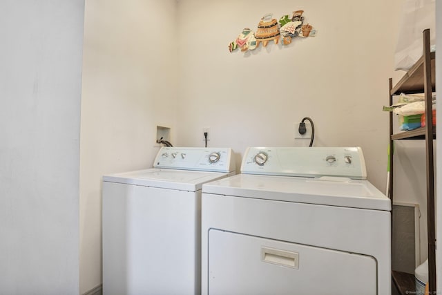 laundry area with washing machine and dryer