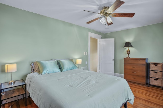 bedroom featuring wood-type flooring and ceiling fan