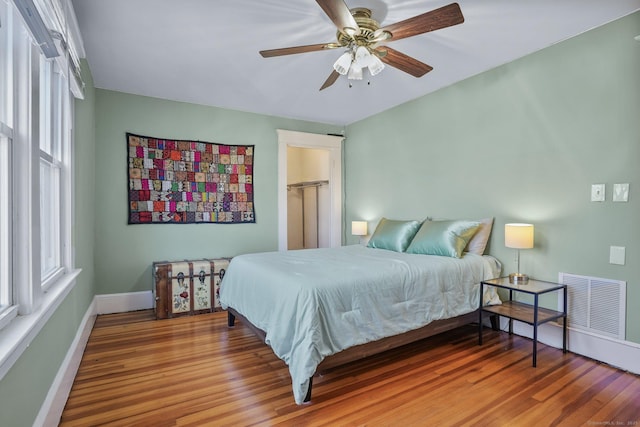 bedroom featuring hardwood / wood-style flooring and ceiling fan