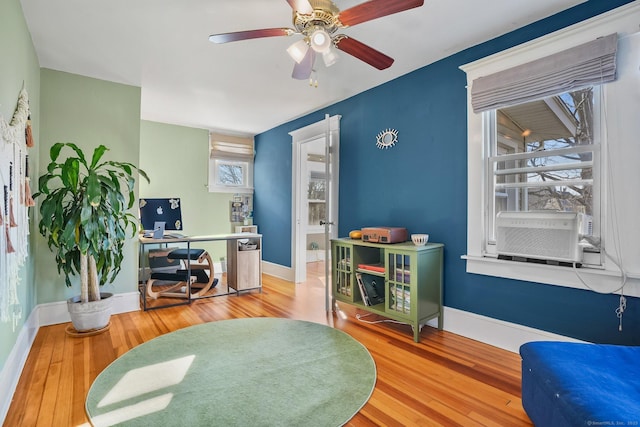 office with hardwood / wood-style floors, ceiling fan, and cooling unit