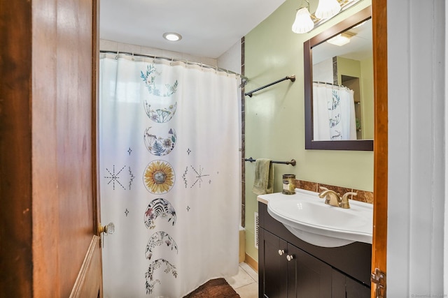 bathroom with tile patterned flooring and vanity