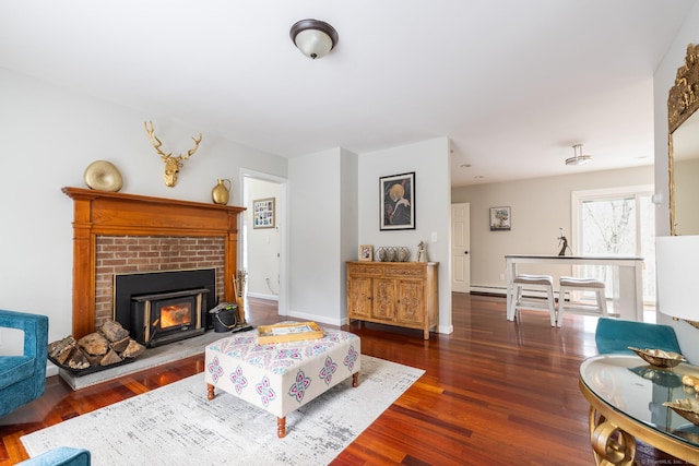 living room with a fireplace and dark hardwood / wood-style floors