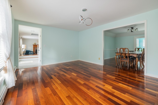 dining room featuring dark hardwood / wood-style floors and a notable chandelier