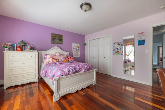 bedroom featuring a closet and dark wood-type flooring