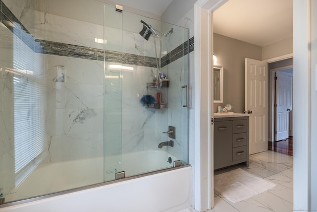 bathroom featuring vanity and combined bath / shower with glass door