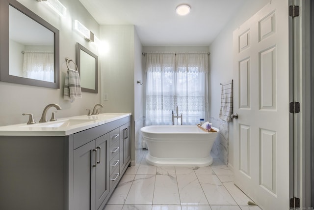 bathroom featuring a bathing tub and vanity