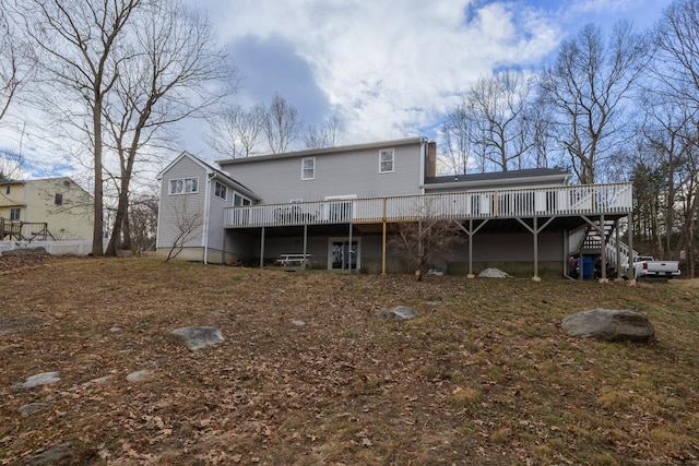 back of property with a wooden deck