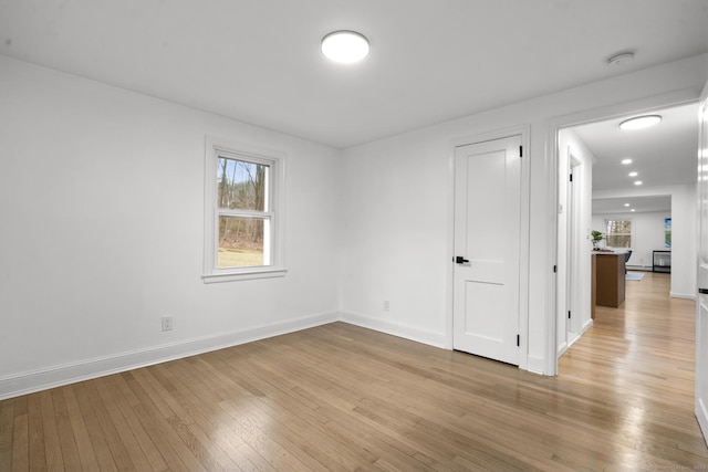 spare room featuring light wood-type flooring