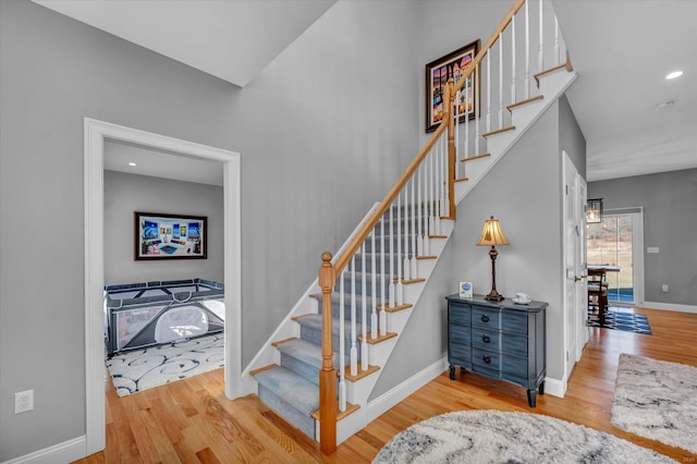 stairs with wood-type flooring