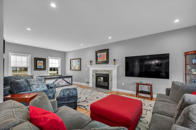 living room with a fireplace and light hardwood / wood-style floors