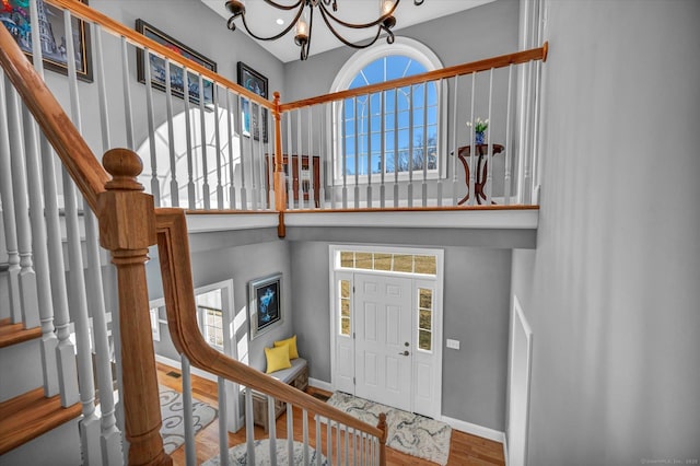 entryway with a chandelier and hardwood / wood-style floors