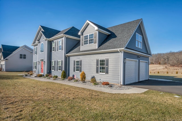 view of front facade with a garage and a front yard