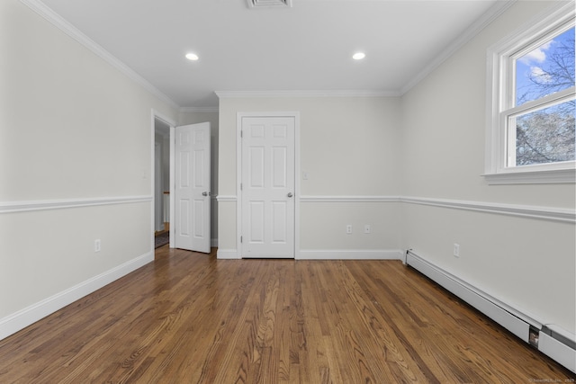 unfurnished bedroom with crown molding, a baseboard heating unit, baseboards, recessed lighting, and wood finished floors