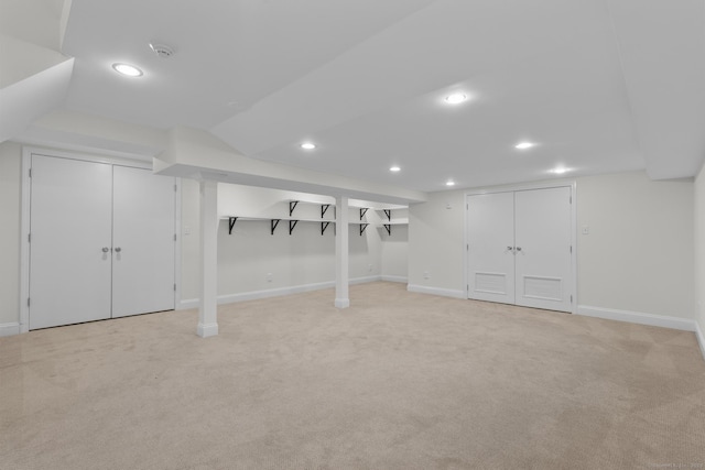 finished basement with recessed lighting, baseboards, and light colored carpet