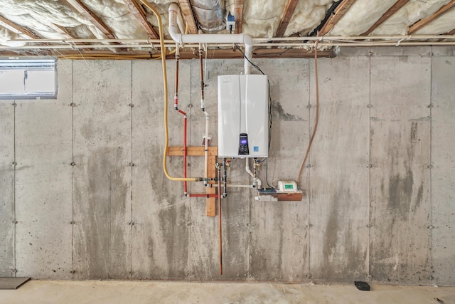 utility room featuring water heater