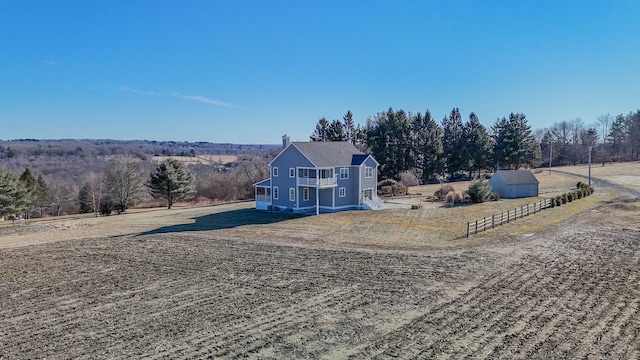 view of front of property with a rural view