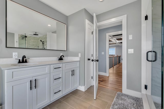 bathroom featuring beam ceiling, a shower with door, vanity, and coffered ceiling