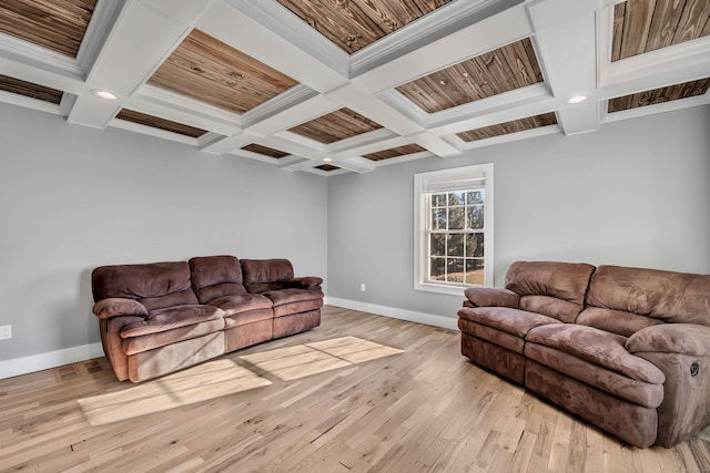 living room featuring ornamental molding, coffered ceiling, beam ceiling, wooden ceiling, and light hardwood / wood-style floors